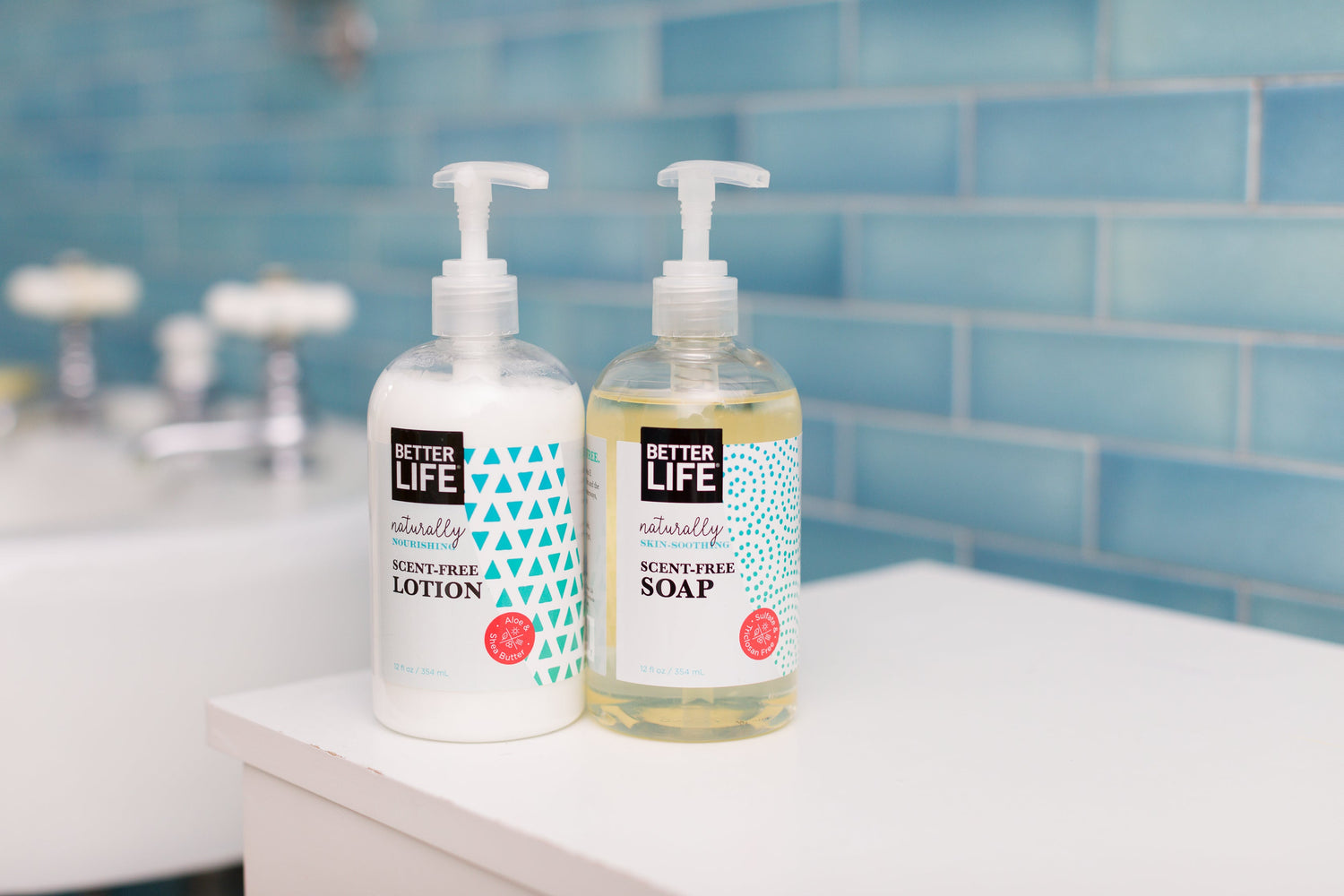 Two bottles of Better Life hand soap sitting on a counter.